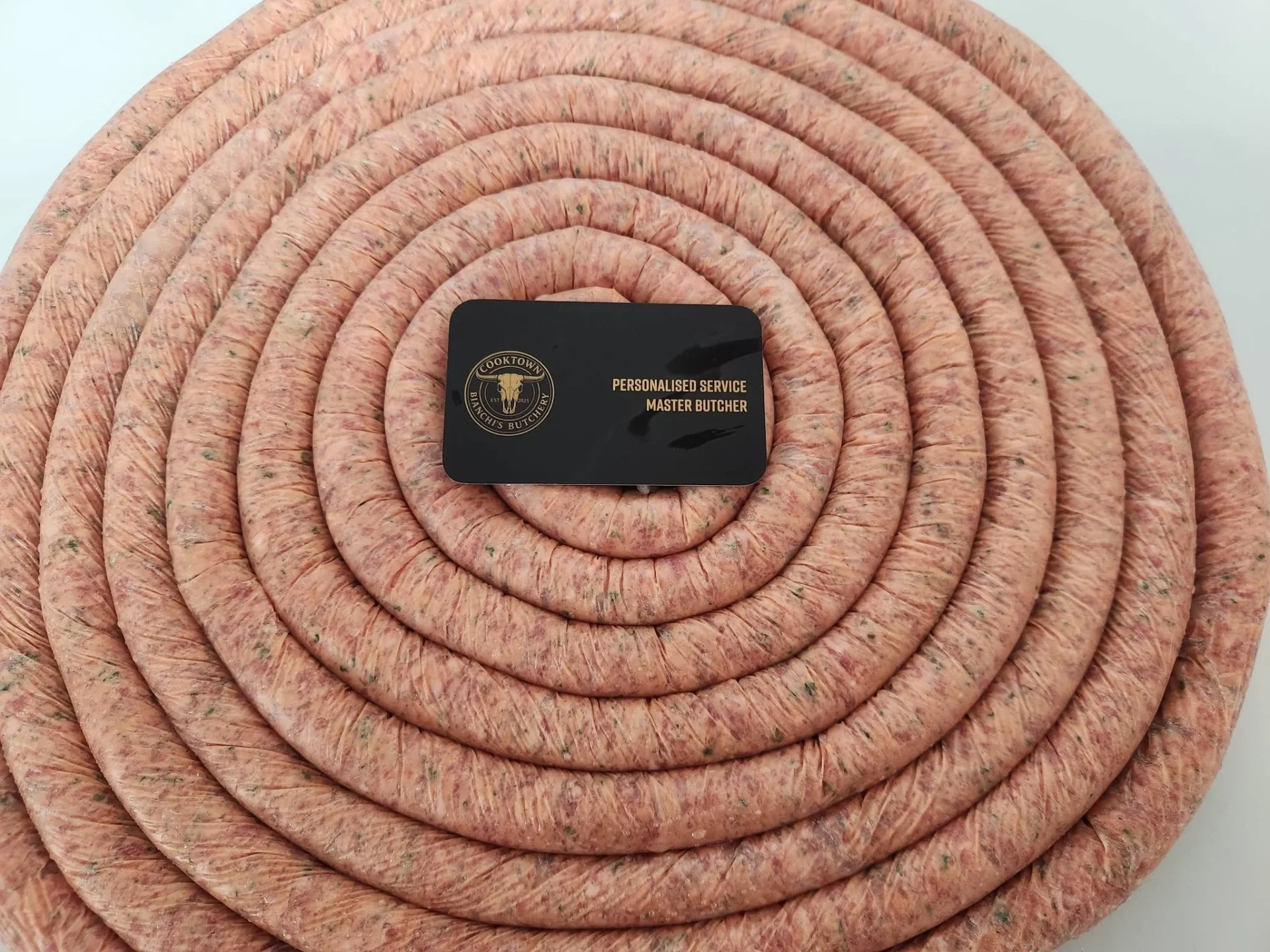A variety of handmade sausages on display in the cabinet at Bianchi's Butchery Cooktown